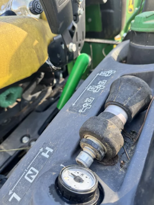 Photo or a PTO extension lever for John Deere Compact tractors